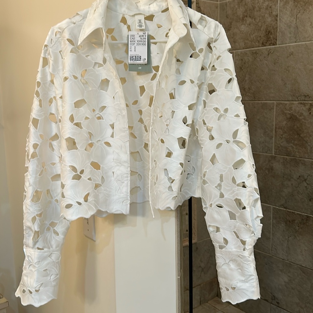 Beautiful jacket or cover up. Design is unique.  Never worn , brand new! W/tags